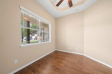 Empty room with ceiling fan, hardwood / wood-styl