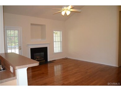 Family Room. Vaulted Ceiling. Door to Screened Por