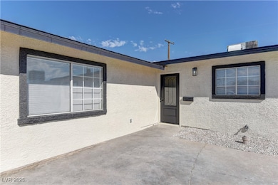 View of exterior entry with stucco siding