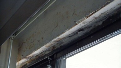 Water damage to wall above patio door (5