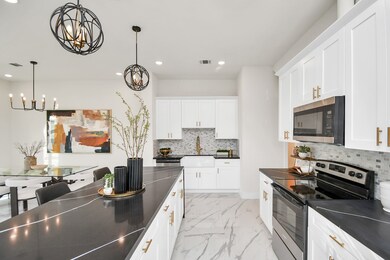 Chef's dream kitchen; upgraded waterfall island wi