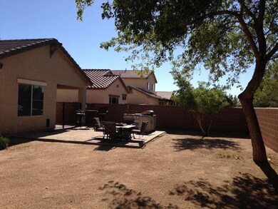 Backyard with stone entertainment area