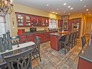 Fully equipped with fireplace. Door to covered Tre