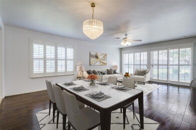 Virtual staging: Dining space with dark hardwood /