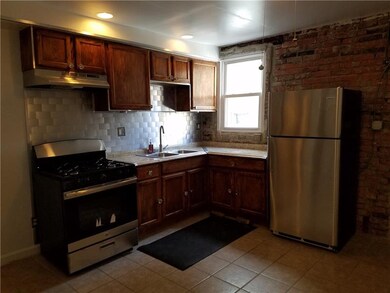 Kitchen features ample storage, new gas range and 