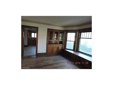 Formal dining room with original built-ins and win