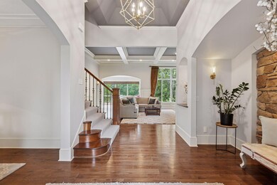 Welcome your guests into your spacious foyer with ceiling details and a welcoming alcove with stone details.