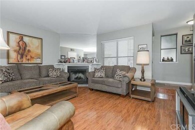 Living room with fireplace and wood floors