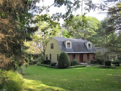 Dutch Colonial style with 3 car garage!