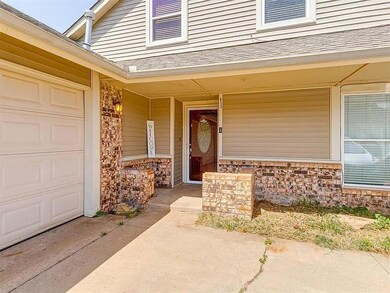 Doorway to property with a garage