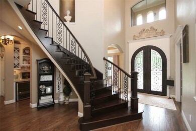 Greet guests in a stunning two story foyer that extends to a reception area and open to the family room and dining area. The trim throughout the home is exceptional and extensive.