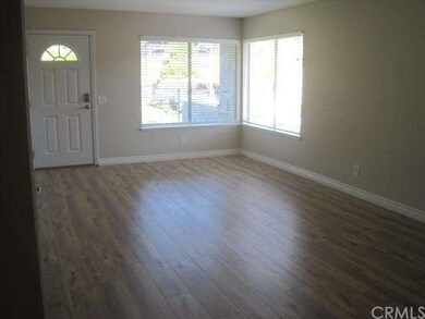 Large Living room with Beautiful laminate flooring