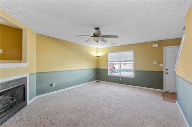 Unfurnished living room featuring carpet floors, c