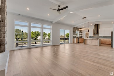 Open living rooms feature lots of natural light, a gas fireplace and vaulted ceilings.