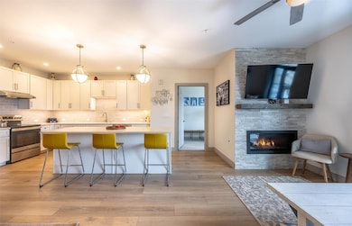 Kitchen with light countertops, stainless steel el