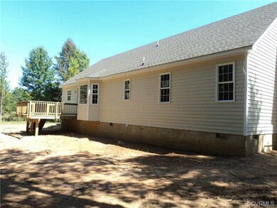 Rear of home with deck, taken on 9/20/14