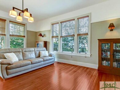 Spacious, bright living room with hardwood floor a