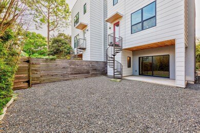 Large backyard features low maintenance hardscapin