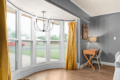 Dining room featuring a textured wall, wood finis