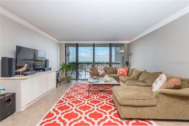 Large living room leading to balcony with incredib