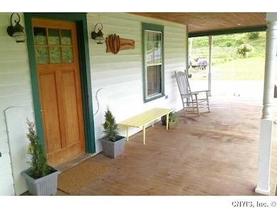 Porch - Open. Wide, open and inviting front porch.
