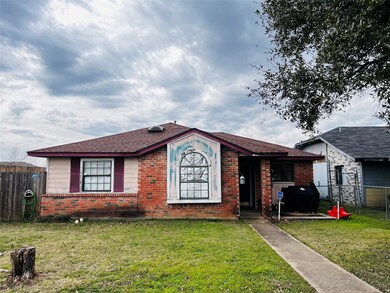 Ranch-style home featuring a front yard