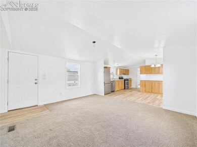 Unfurnished living room featuring visible vents, l