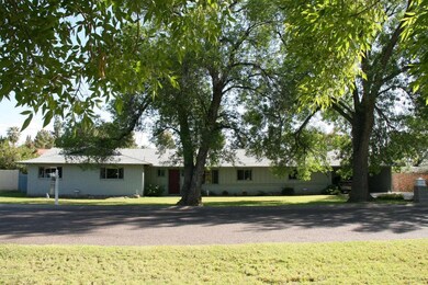 Orchid - wide view of the front of home