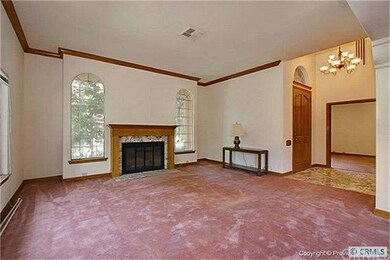 Expansive formal living room with fireplace