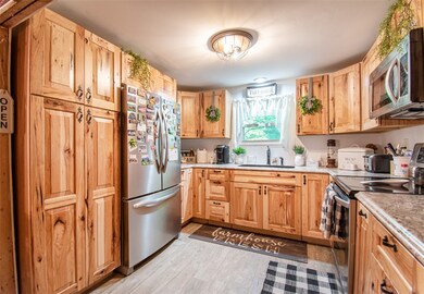 Updated kitchen with natural hickory cabinets