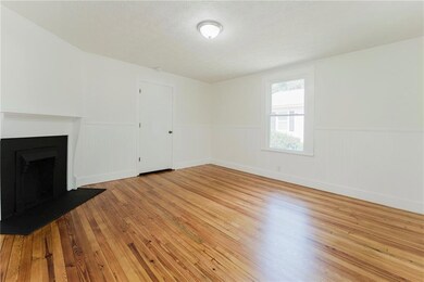 Unfurnished living room with light hardwood / wood
