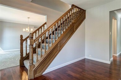 Large entry flanked by formal living & dining room