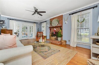 Large Den, Wood Burning Fireplace, French Doors to