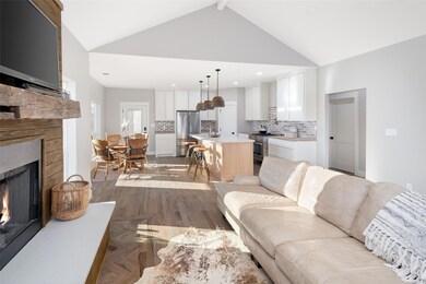 Living room featuring sink, light parquet floors, 