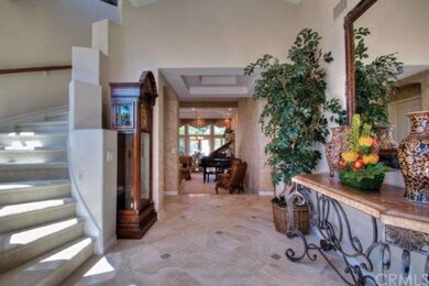 Elegant Entrance Foyer with Limestone flooring, op