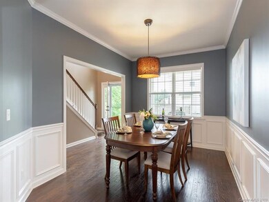Large formal Dining Room with wainscoting and abun