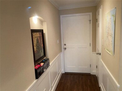 Foyer w/ elaborate woodwork + niche