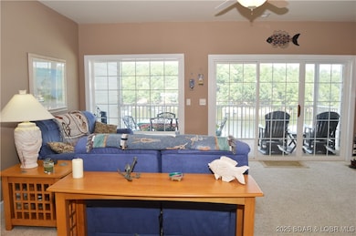 Living Room with wall of windows providing natural lighting