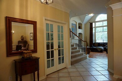 Beautiful entry with study on the left and formal dining room on the right, with views straight ahead to the family room.