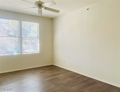 Unfurnished room with dark wood-style flooring and