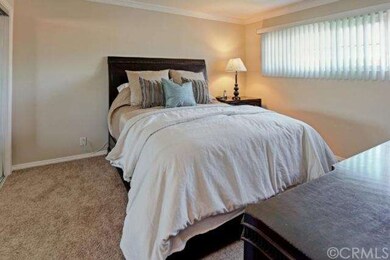 Spacious master bedroom with mirrored closet doors
