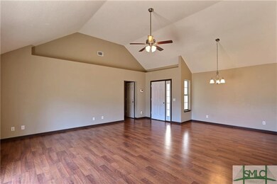 Beautiful wood floors, vaulted ceiling and planter