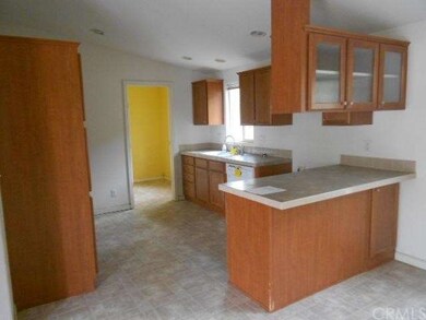 full view of kitchen door leads to laundry room an