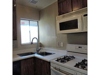 Property Photo. Kitchen with window