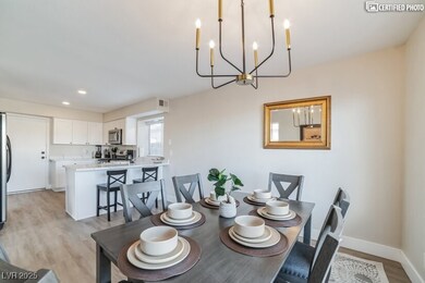Dining area with a chandelier, light wood-style fl