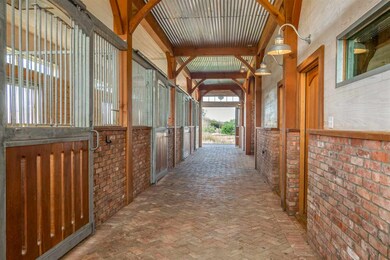 5 stalls with lovely architectured brick flooring 