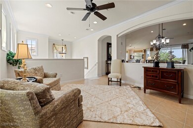 loft area featuring arched walkways, light tile pa