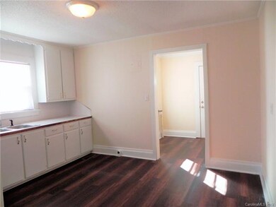 View from living room to eat-in kitchen