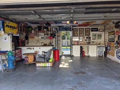 Garage/ mancave with bathroom in back left corner.