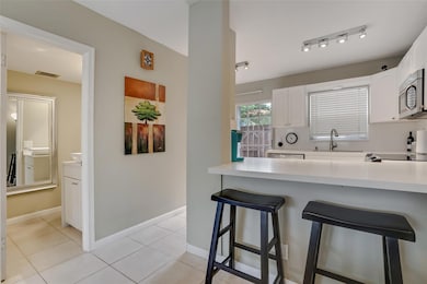 Kitchen and entry to half bath